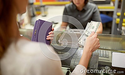 Woman paying money at store cash register Stock Photo