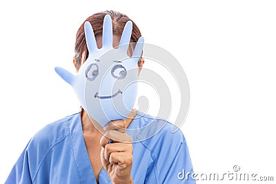 Woman pediatrician covering her face with smiling latex glove Stock Photo