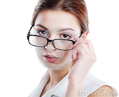 Woman peering over glasses Stock Photo