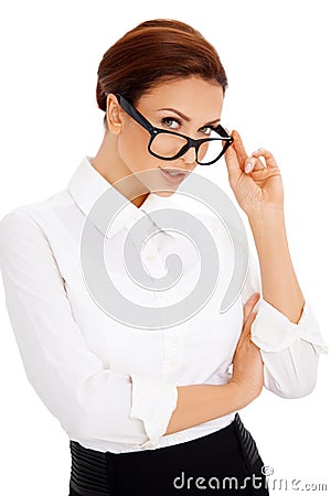 Woman peering over her glasses Stock Photo
