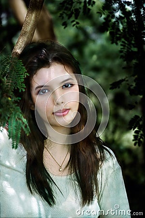 Woman with Pendant in Deep Woods Stock Photo