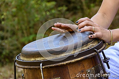 Woman percussionist hands playing a drum Stock Photo