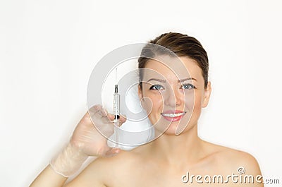 Woman with perfect skin, hand with syringe for injection Stock Photo