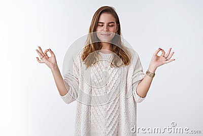 Woman perform breathing yoga practice gathering patience calm down smiling broadly relieved feeling happy relaxed Stock Photo