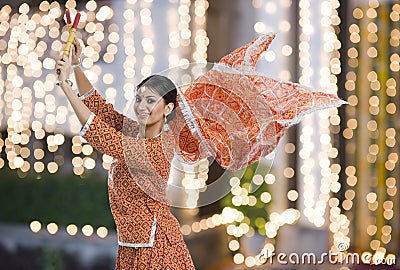 Woman performing Dandiya Raas on Navratri Stock Photo