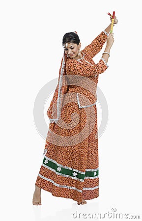 Woman performing Dandiya Raas on Navratri Stock Photo