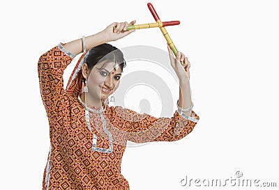 Woman performing Dandiya Raas on Navratri Stock Photo