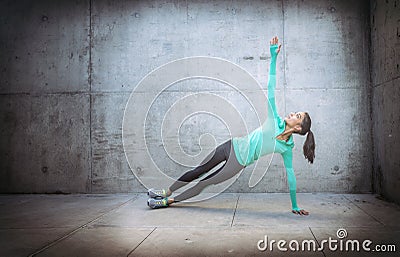 Woman performing yoga exercise Stock Photo