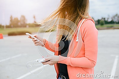 Woman with phone and power bank playing the mobile games Stock Photo