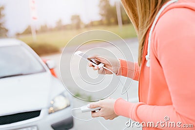 Woman with phone and power bank playing the mobile games Stock Photo