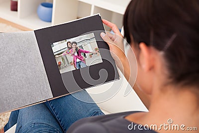 Woman With Photo Album Stock Photo