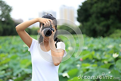 Woman photo grapher taking photo Stock Photo