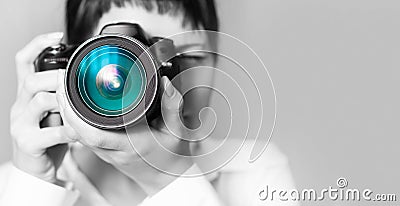 Woman photographer with camera Stock Photo