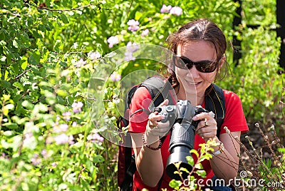 Woman photographer in nature Stock Photo