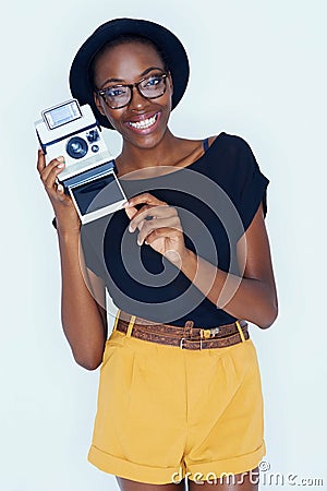 Woman, photographer and portrait in studio with retro camera, creativity and happy artist with creative talent. African Stock Photo