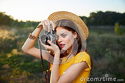 Woman photographer yellow t-shirt snapshot nature fresh air Stock Photo