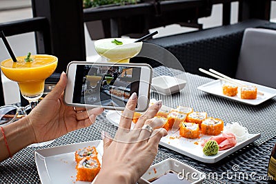 Woman photographing food Stock Photo