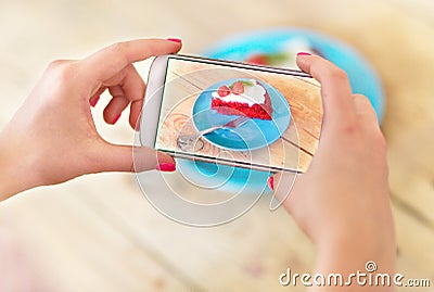 Woman photographing food with smartphone Stock Photo