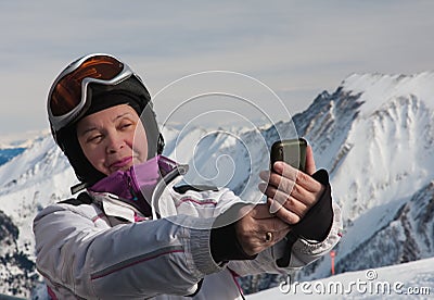 A woman photographs himself smartphone Stock Photo