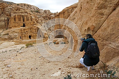 Woman photographs the Obelisk tomb in ancient Petra city in Jordan Stock Photo
