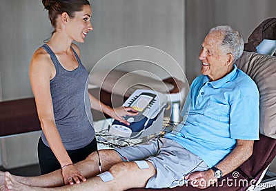 Woman, physiotherapist and bed with senior patient for monitoring vitals, joints or health at clinic. Female person or Stock Photo