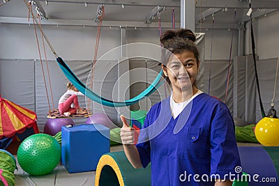 Woman physiotherapist in rehabilitation center in sensory room Stock Photo