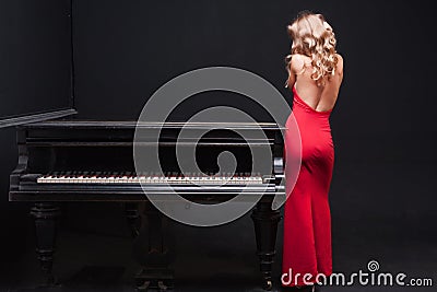 Woman and piano Stock Photo