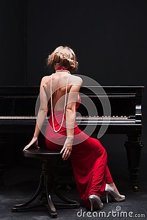 Woman and piano Stock Photo