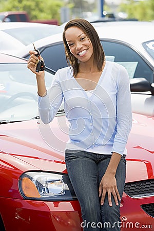 Woman picking up new car Stock Photo