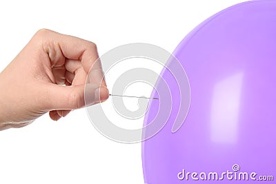 Woman piercing purple balloon on white background Stock Photo