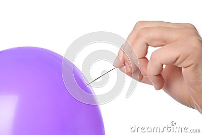 Woman piercing purple balloon on white background Stock Photo