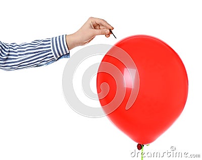 Woman piercing red balloon on white background Stock Photo