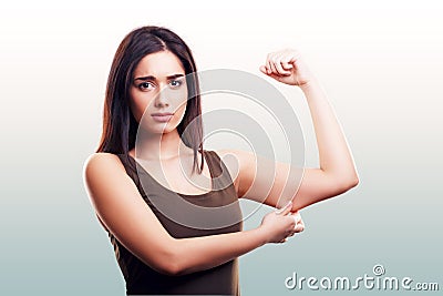 Woman pinching flabby fat arm skin Stock Photo