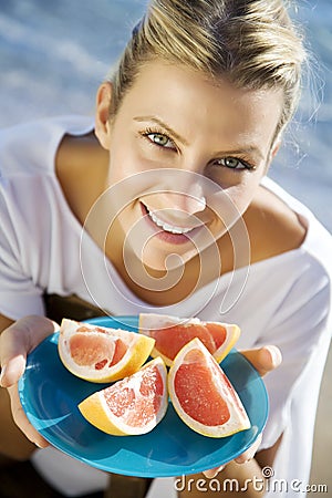 Woman with pink grapefruit Stock Photo