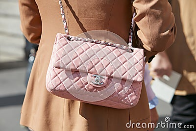 Woman with pink leather Chanel bag before Genny fashion show, Milan Fashion Week street style Editorial Stock Photo