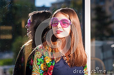 Woman in pink sunglasses Stock Photo