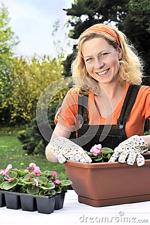 Woman planting flowers Stock Photo