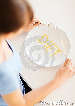 Woman with plate and meds Stock Photo