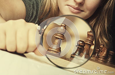 Woman play chess Stock Photo