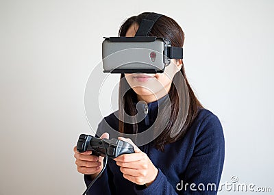 Woman play game on vr device Stock Photo