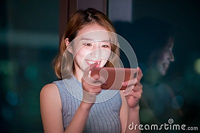 Woman play mobile game Stock Photo