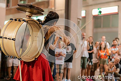 a woman play music on the street Editorial Stock Photo