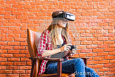 Woman play video game with joystick and VR device Stock Photo