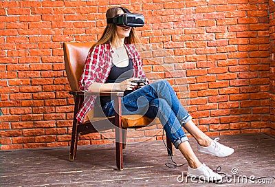 Woman play video game with joystick and VR device Stock Photo