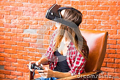 Woman play video game with joystick and VR device Stock Photo