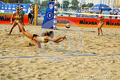 Woman player save in beach volleyball game Editorial Stock Photo