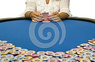 Woman playing cards with poker chips Stock Photo