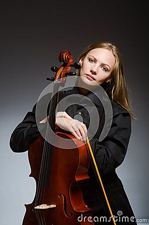 The woman playing classical cello in music concept Stock Photo