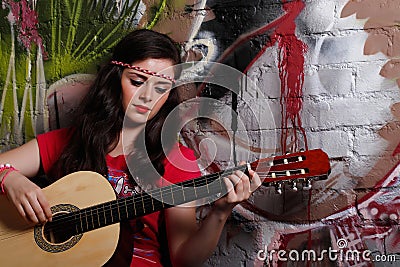 Woman playing the guitar Stock Photo