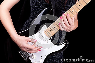 Woman playing on guitar Stock Photo